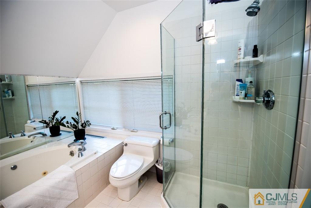91 Conover Road West Windsor, NJ 08550 - Photo 17 of 25 a bathroom with a sink a toilet and shower