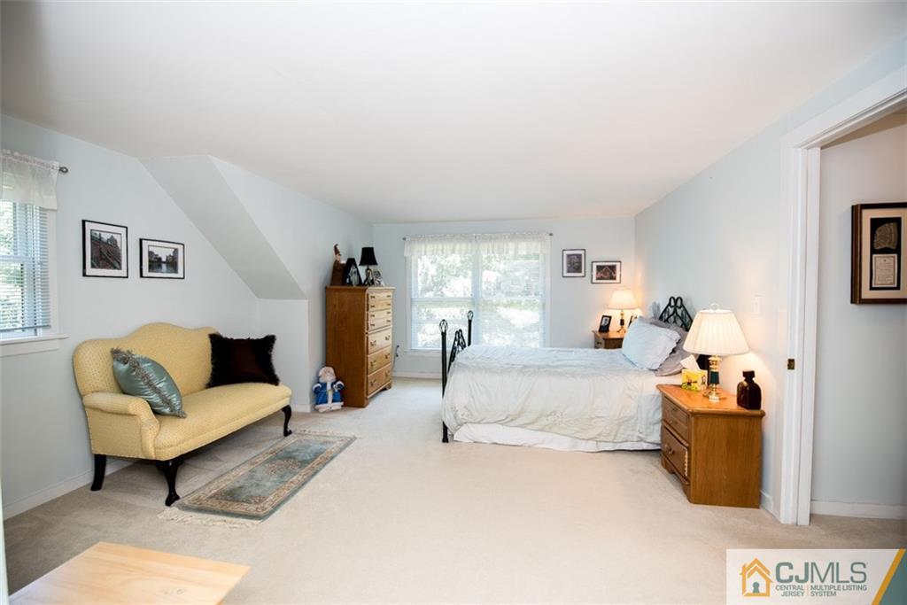 91 Conover Road West Windsor, NJ 08550 - Photo 18 of 25 a living room with furniture and a couch