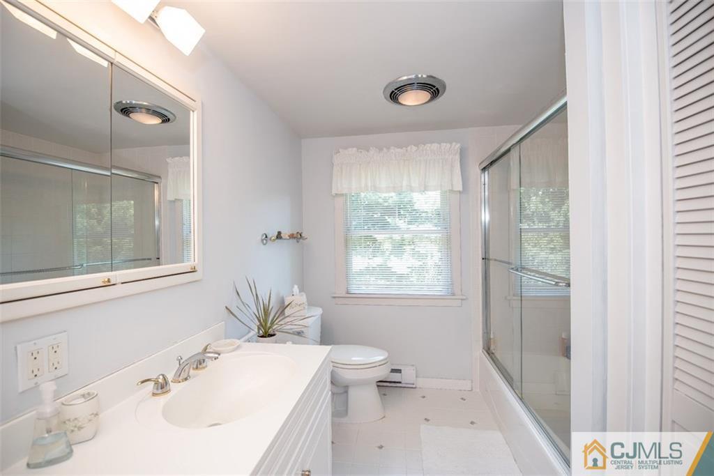 91 Conover Road West Windsor, NJ 08550 - Photo 20 of 25 a bathroom with a sink a toilet and shower
