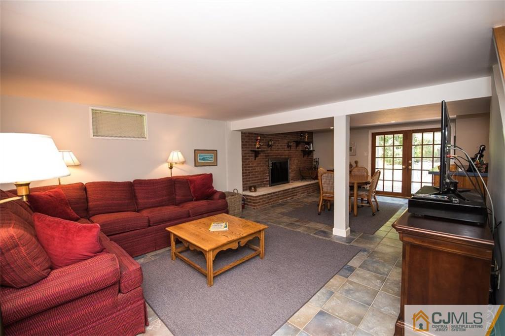 91 Conover Road West Windsor, NJ 08550 - Photo 21 of 25 a living room with furniture a rug and a window