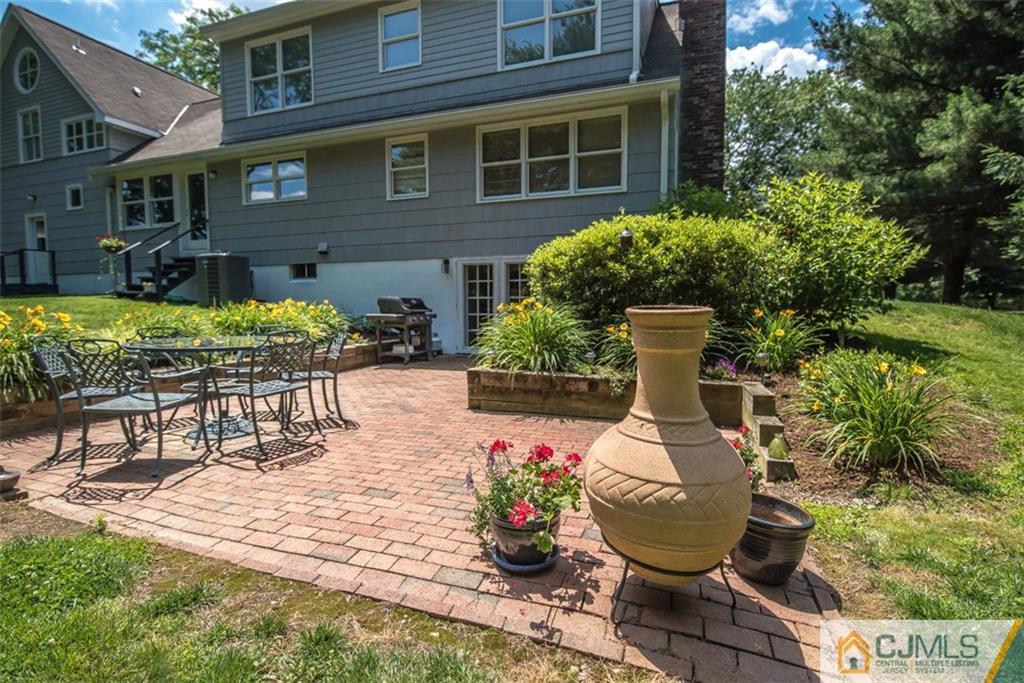91 Conover Road West Windsor, NJ 08550 - Photo 22 of 25 a backyard of a house with outdoor seating