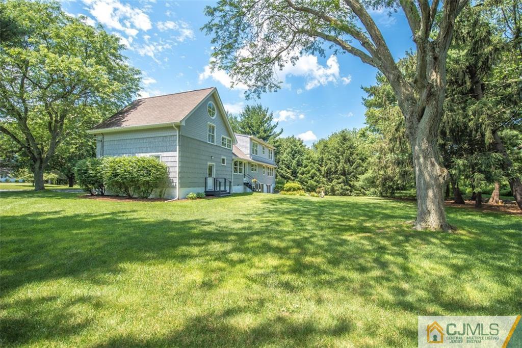 91 Conover Road West Windsor, NJ 08550 - Photo 24 of 25 a view of a house with a yard