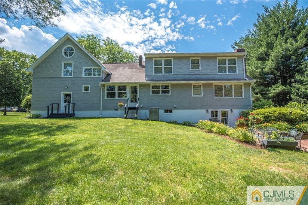 91 Conover Road West Windsor, NJ 08550 - Photo 25 of 25 a front view of house with yard and trees around