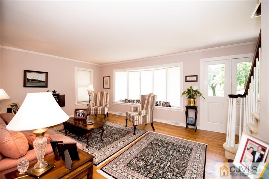 91 Conover Road West Windsor, NJ 08550 - Photo 4 of 25 a living room with furniture and a rug