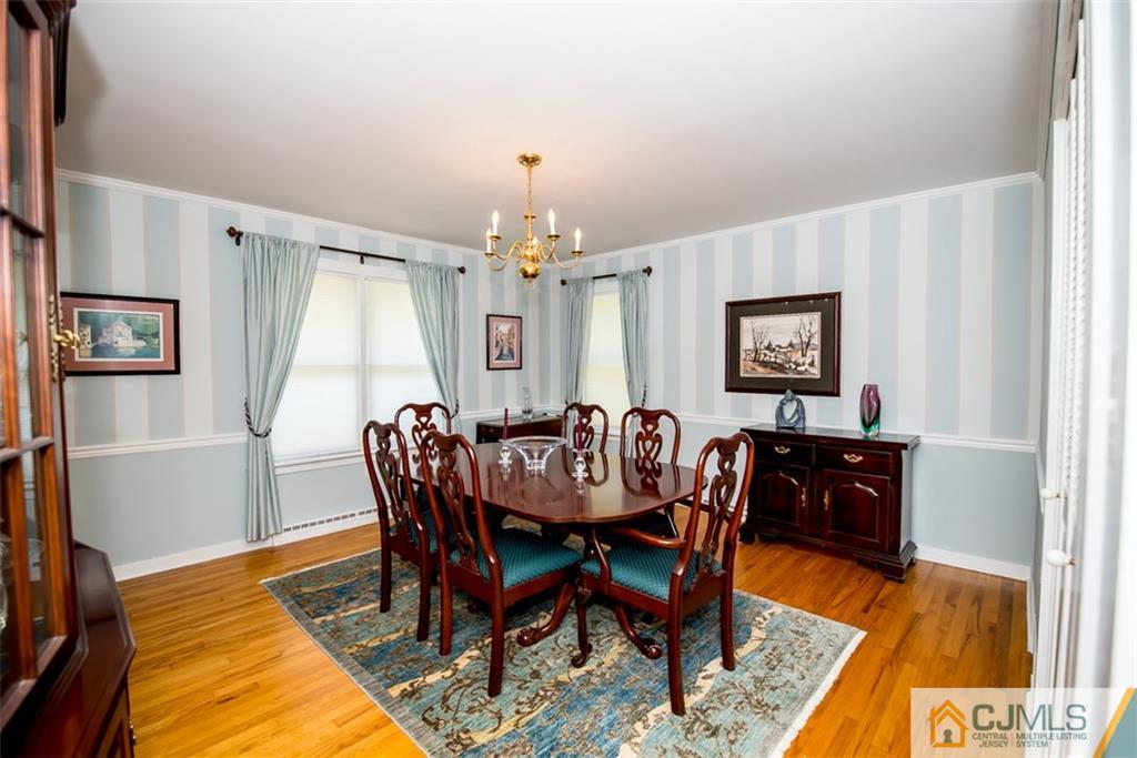 91 Conover Road West Windsor, NJ 08550 - Photo 5 of 25 a view of a dining room with furniture window and wooden floor
