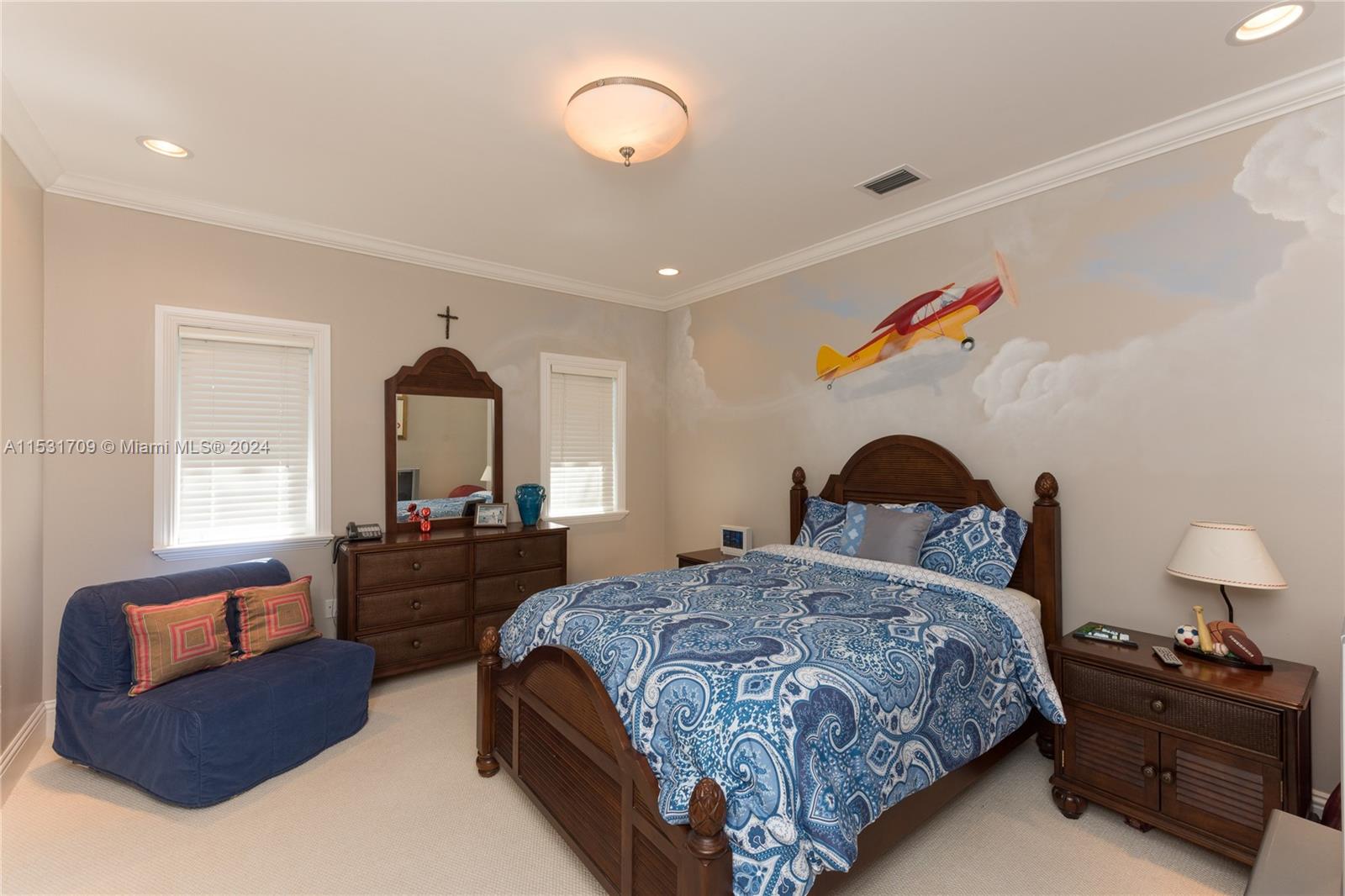 5655 Pine Tree Drive Miami Beach, FL 33140 - Photo 16 of 21 a bedroom with a bed and furniture