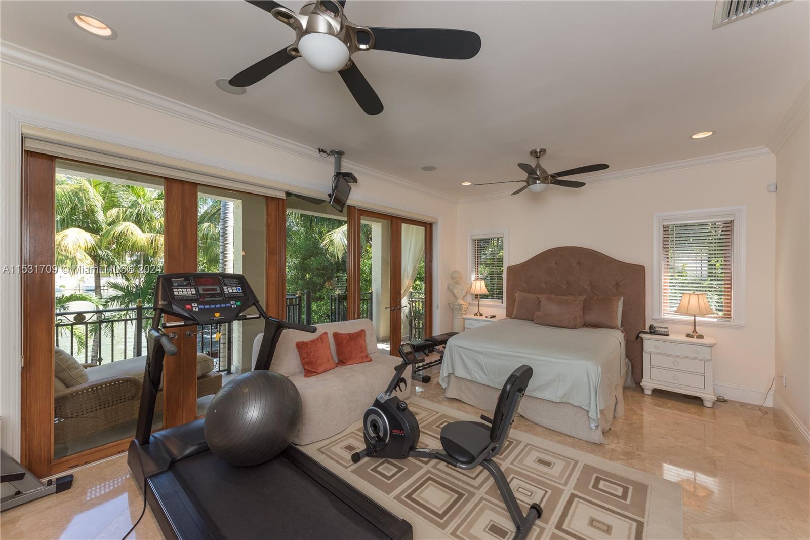 5655 Pine Tree Drive Miami Beach, FL 33140 - Photo 17 of 21 a living room with furniture and a large window