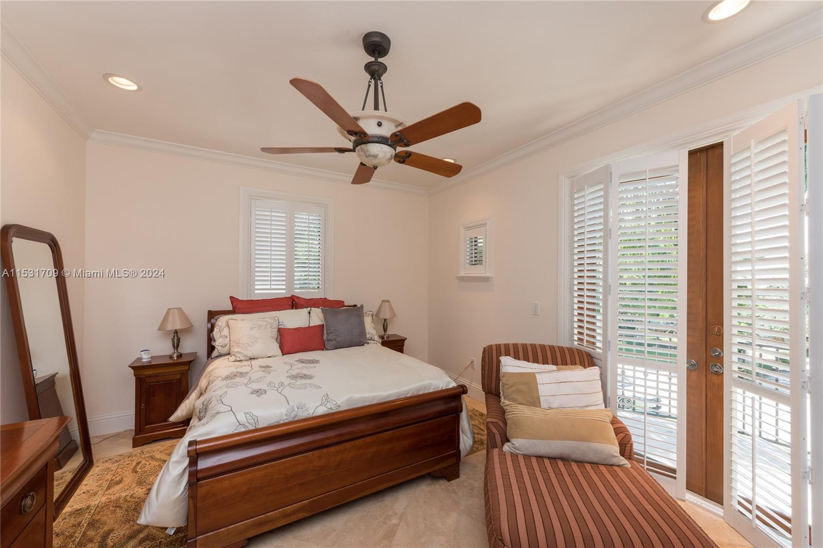 5655 Pine Tree Drive Miami Beach, FL 33140 - Photo 19 of 21 a bedroom with a bed and wooden floor