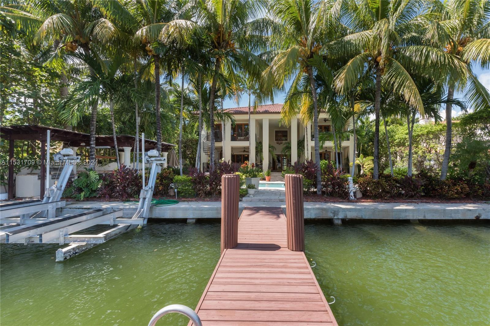 5655 Pine Tree Drive Miami Beach, FL 33140 - Photo 20 of 21 a view of swimming pool with lounge chair