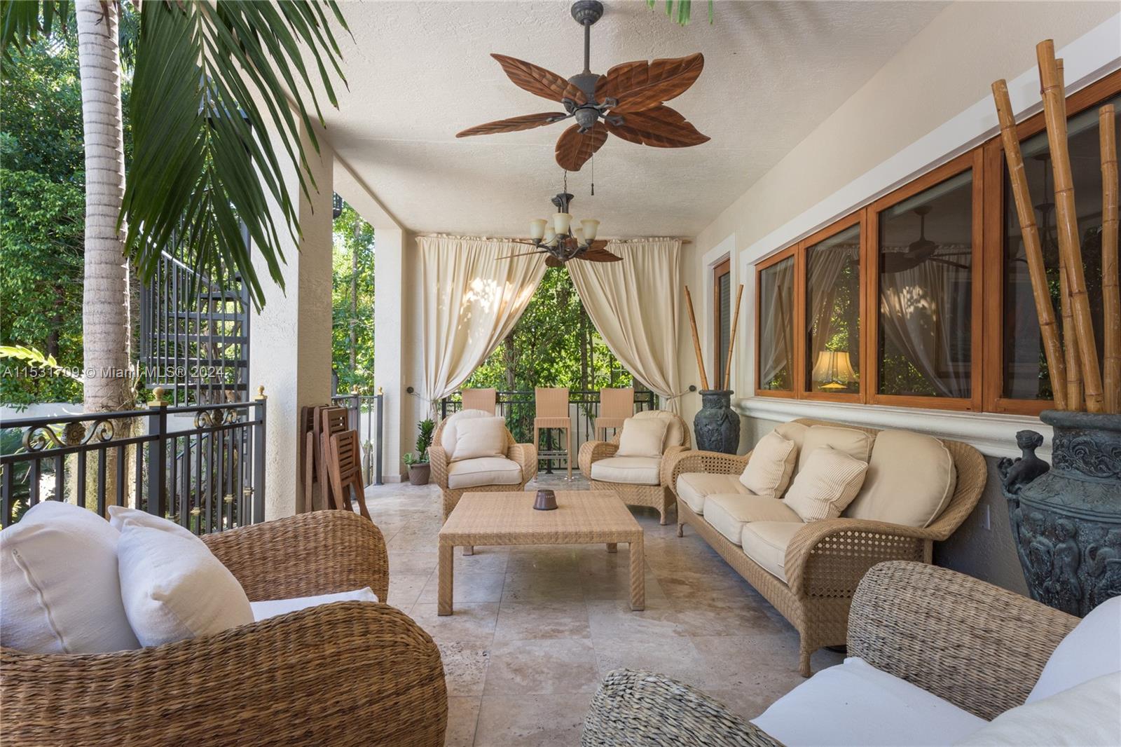 5655 Pine Tree Drive Miami Beach, FL 33140 - Photo 9 of 21 a living room with furniture and a large window