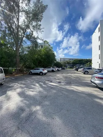 a view of street with parked cars