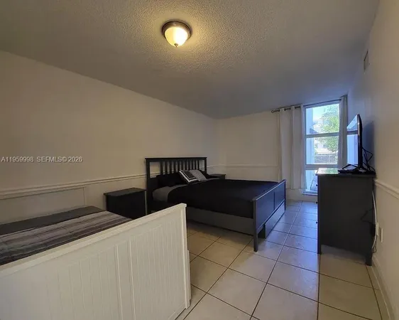 a living room with a couch and a stove top oven
