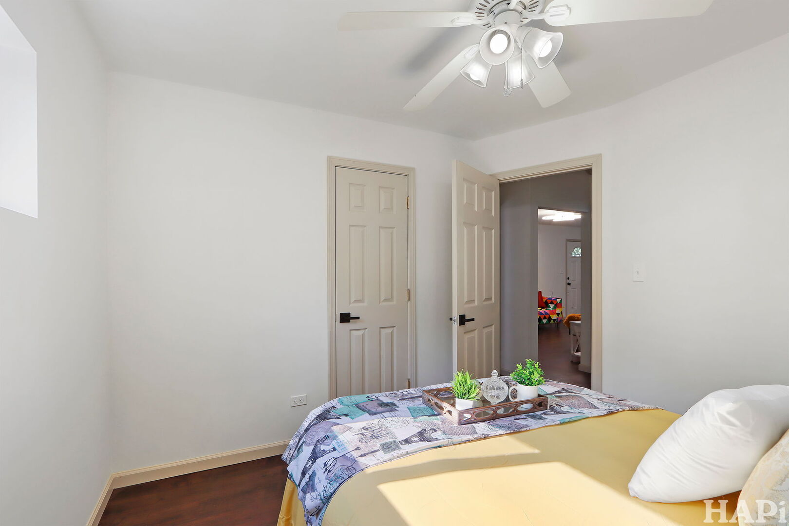 2440 West Cheyenne Road Waukegan, IL 60087 - Photo 11 of 26 a bedroom with a bed and a chandelier