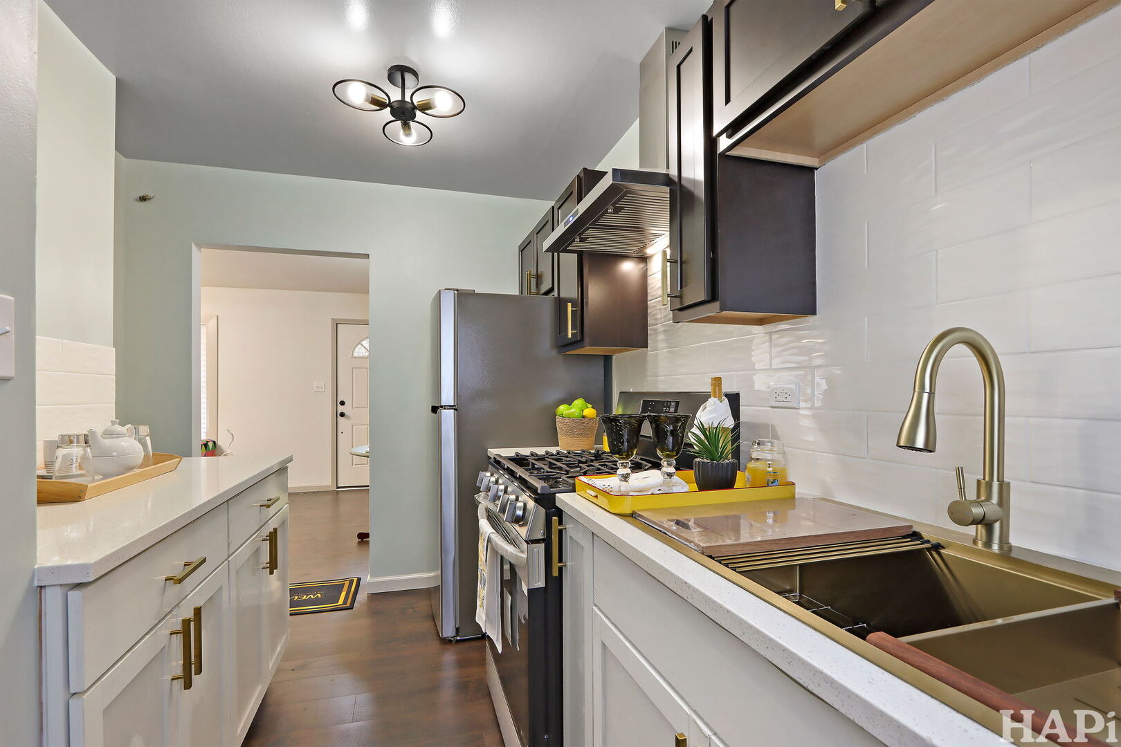 2440 West Cheyenne Road Waukegan, IL 60087 - Photo 3 of 26 a kitchen with stainless steel appliances a sink a stove and cabinets