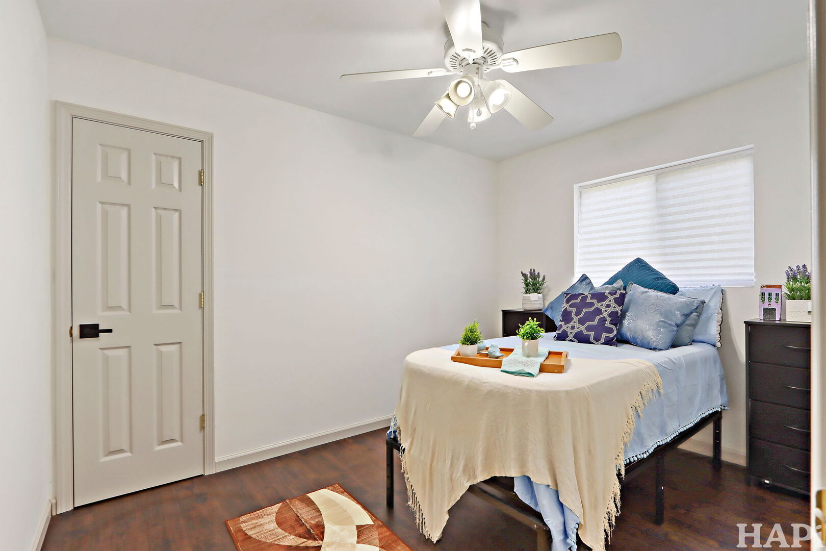 2440 West Cheyenne Road Waukegan, IL 60087 - Photo 9 of 26 a bedroom with a bed and a chandelier