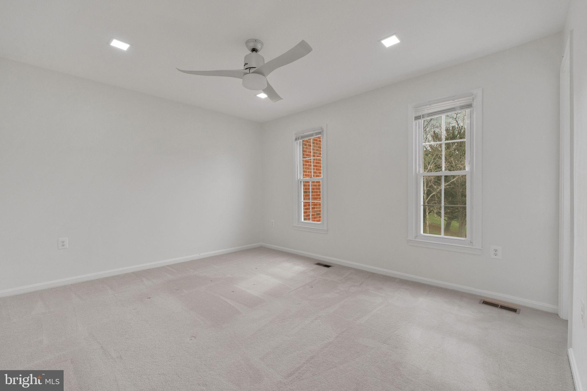 6002 Mardale Lane Burke, VA 22015 - Photo 13 of 28 an empty room with windows and fan