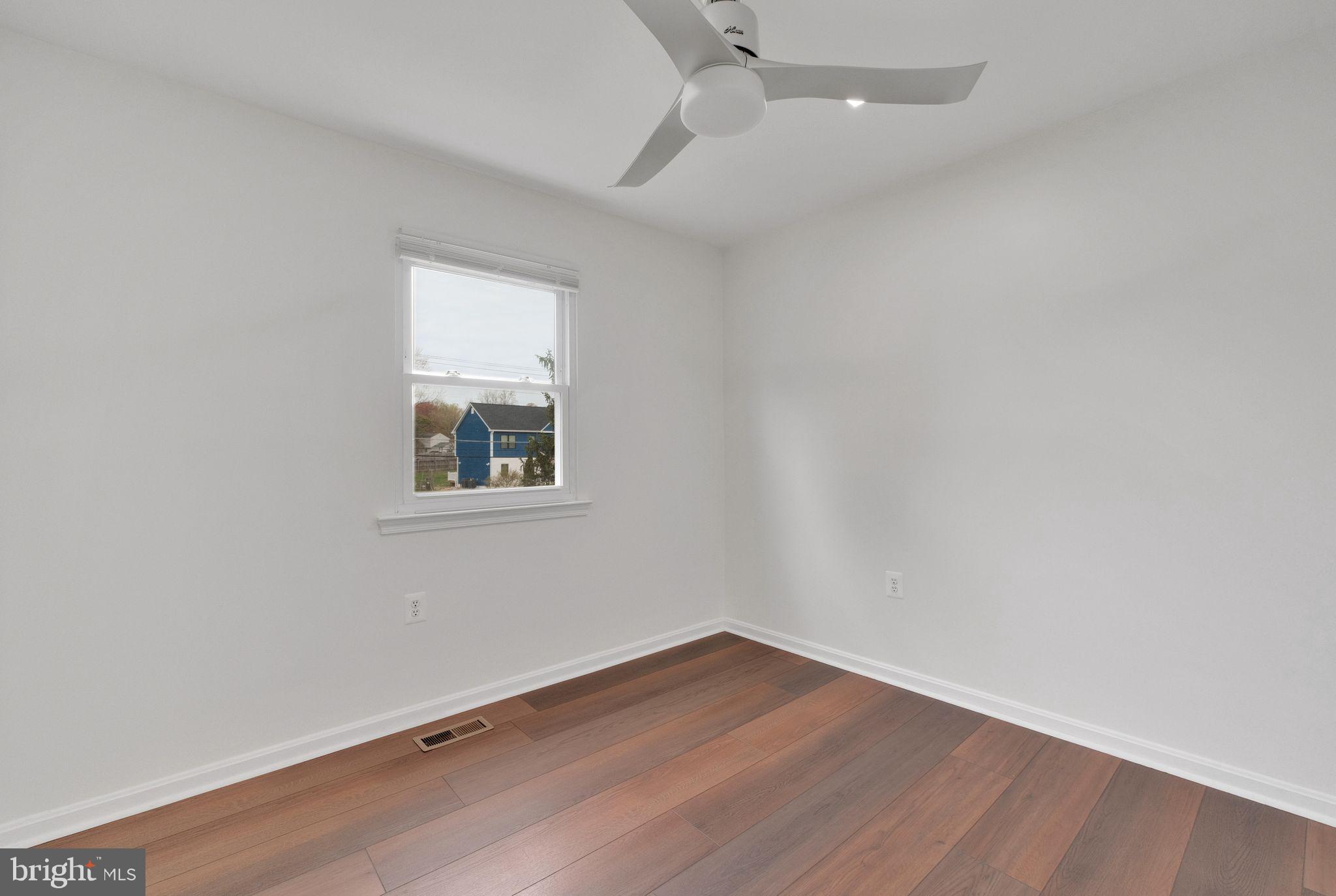 6002 Mardale Lane Burke, VA 22015 - Photo 16 of 28 wooden floor in an empty room with a window
