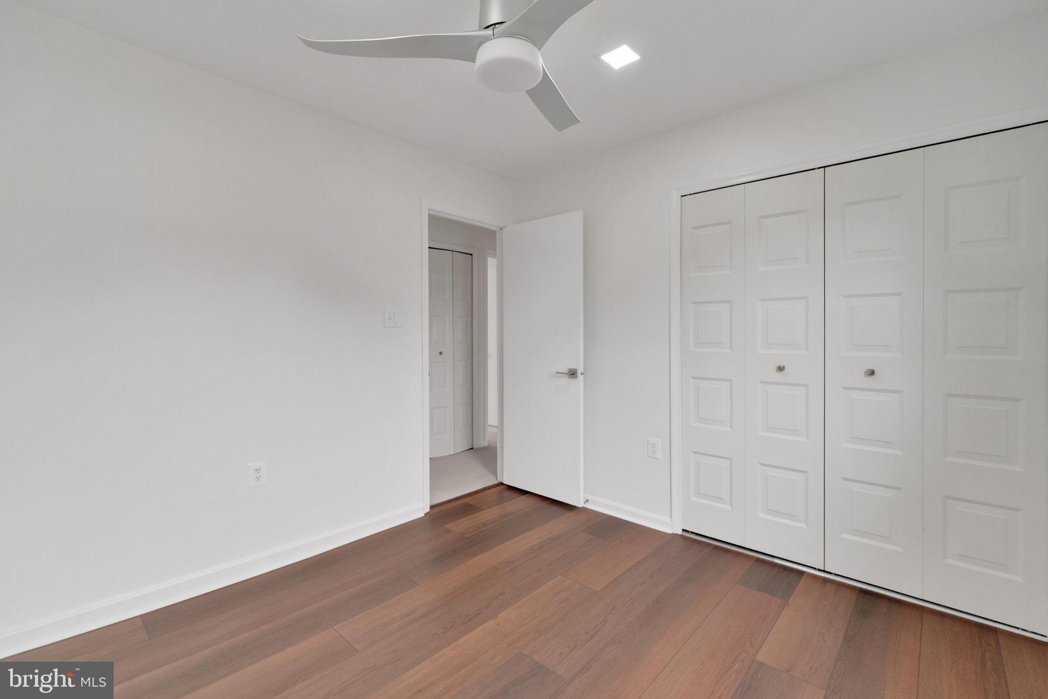 6002 Mardale Lane Burke, VA 22015 - Photo 17 of 28 a view of an empty room with wooden floor