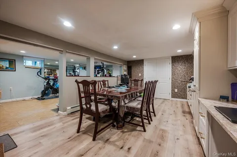 a view of a dining room with furniture and wooden floor