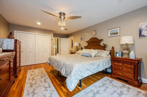 a bedroom with a large bed and a large window
