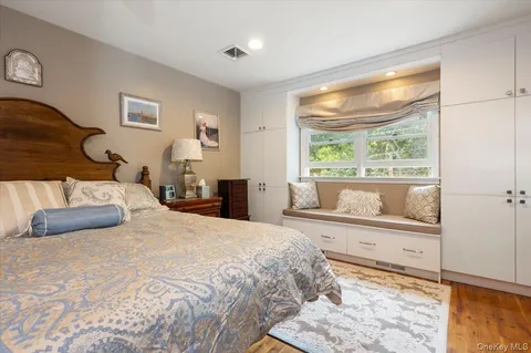 a bathroom with a granite countertop sink mirror and double