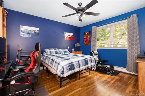 a bathroom with a toilet a sink and a window
