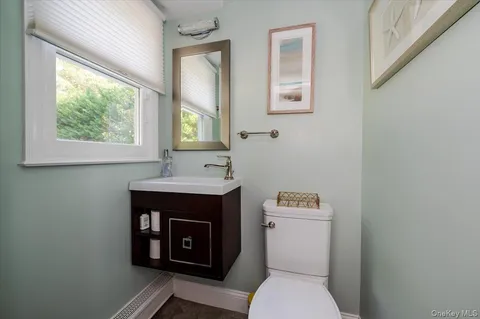 a bathroom with a sink vanity and a mirror