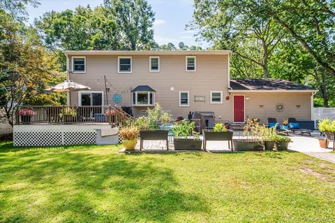 a view of a patio with a table and chairs