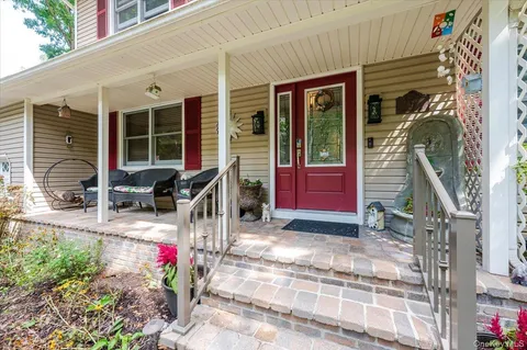 a front view of a house with a porch
