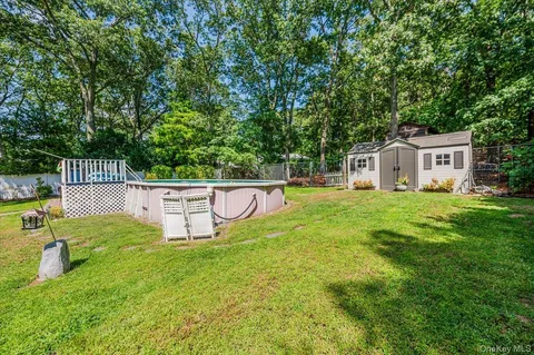 a view of a backyard with sitting area