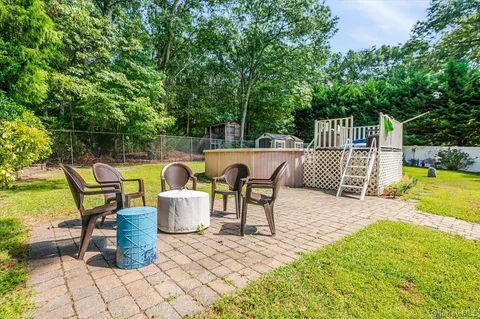 a view of a swimming pool with a yard