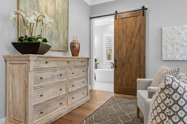 a bedroom with a bed and a dresser