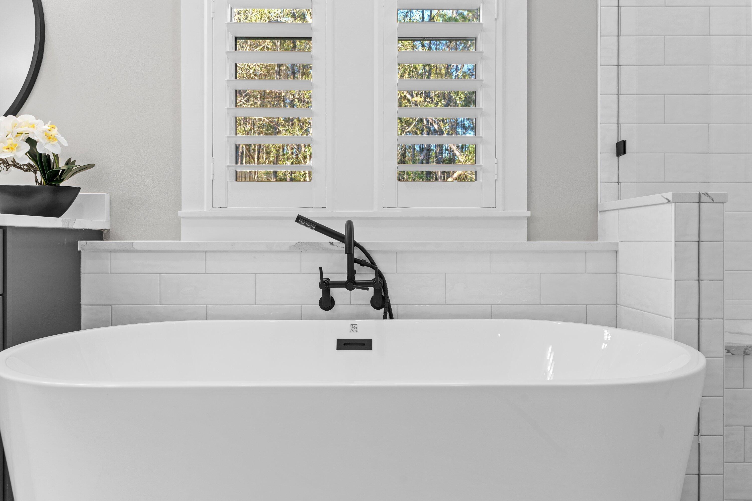 471 Shimmer Circle Freeport, FL 32439 - Photo 31 of 46 a white bath tub sitting next to a window