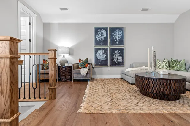 a living room with furniture rug and window