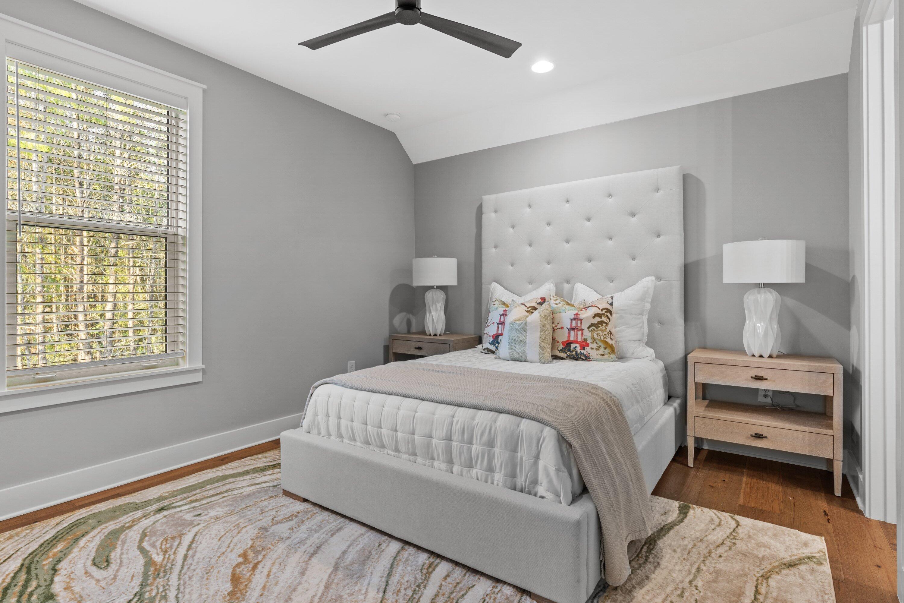 471 Shimmer Circle Freeport, FL 32439 - Photo 42 of 46 a bedroom with a large bed and a window