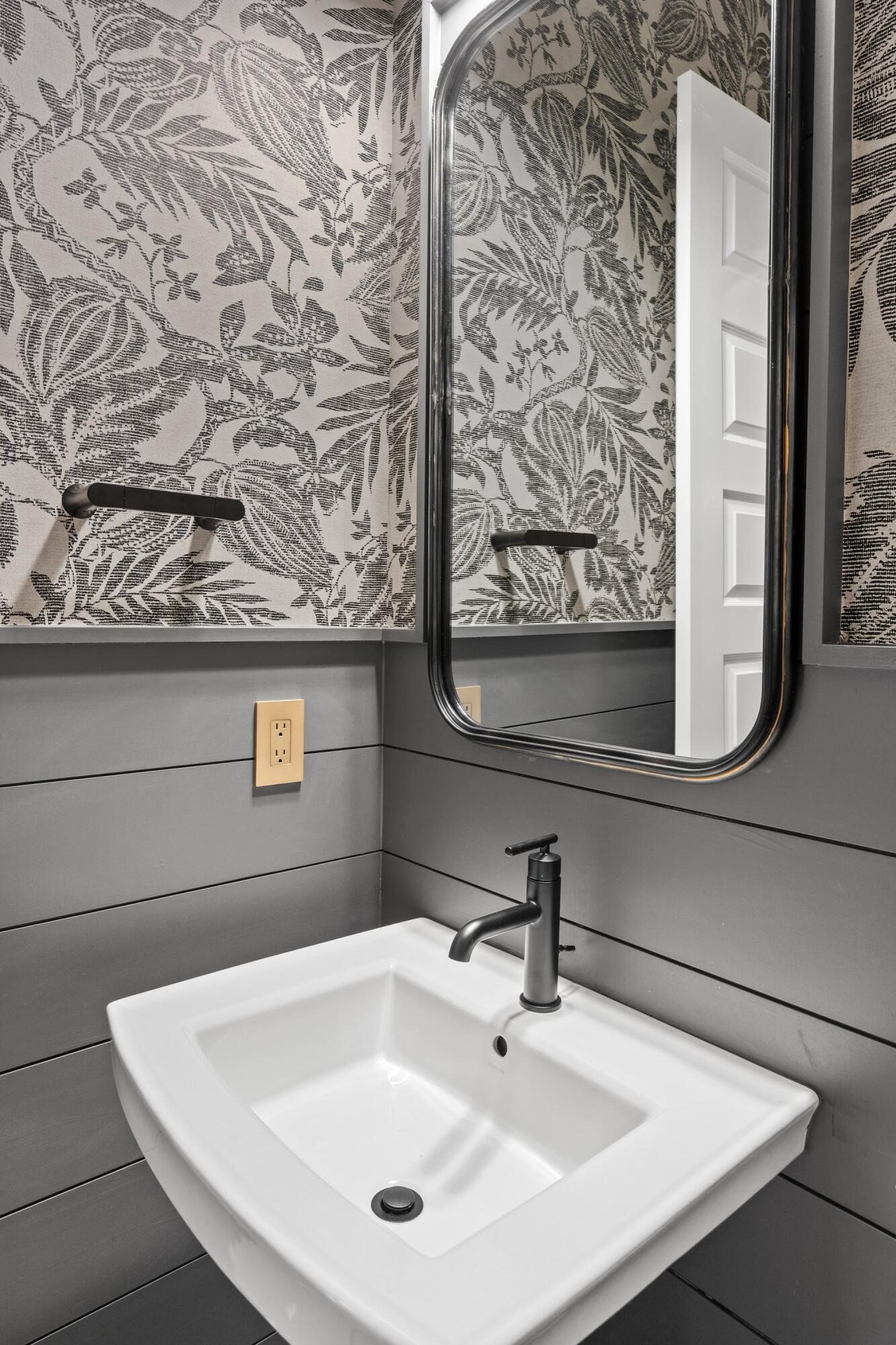 471 Shimmer Circle Freeport, FL 32439 - Photo 44 of 46 a bathroom with a sink and mirror