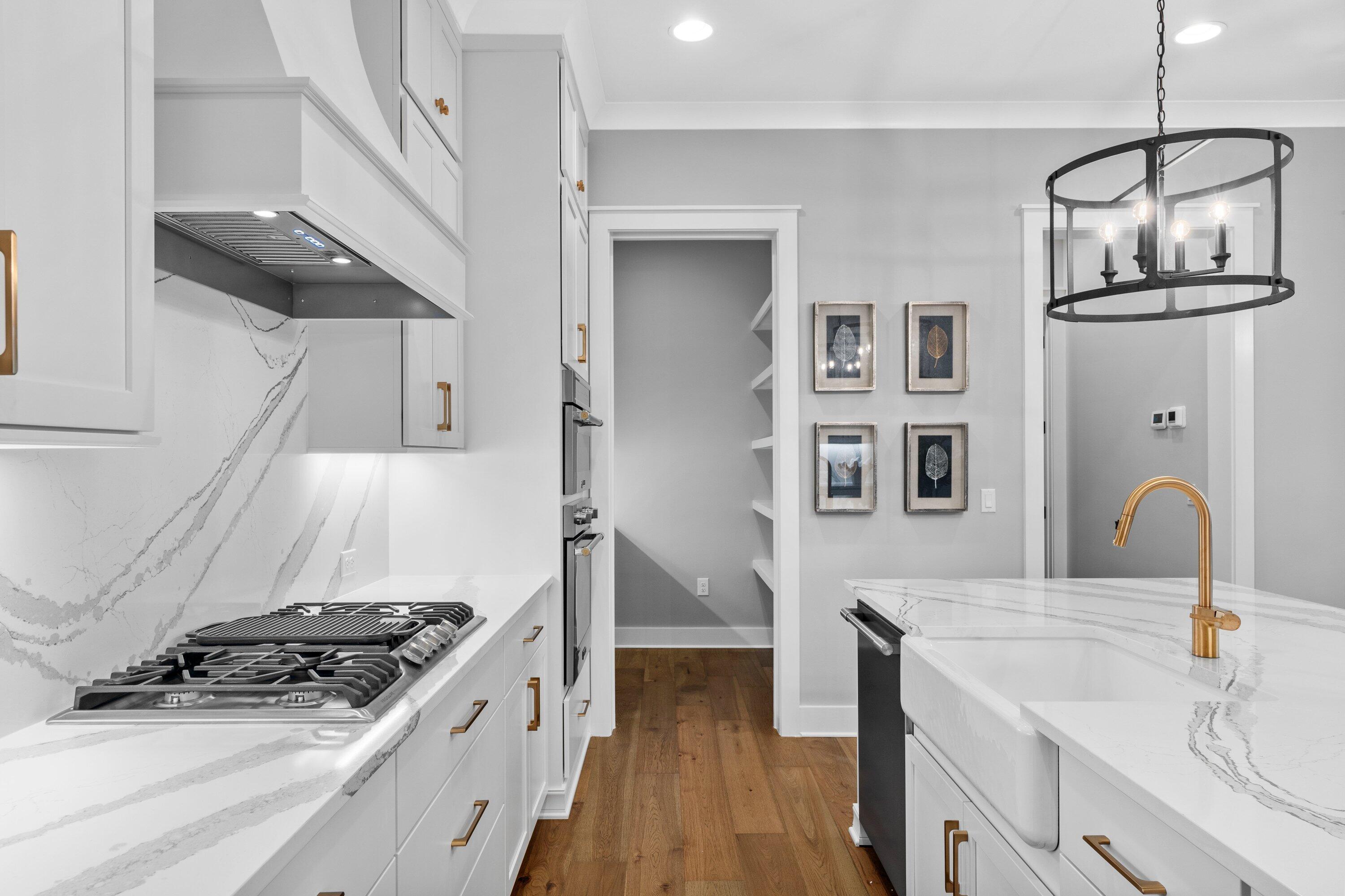 471 Shimmer Circle Freeport, FL 32439 - Photo 9 of 46 a kitchen with stainless steel appliances granite countertop a stove and a sink