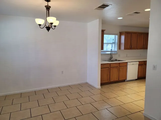 a view of a kitchen with a sink cabinets and window