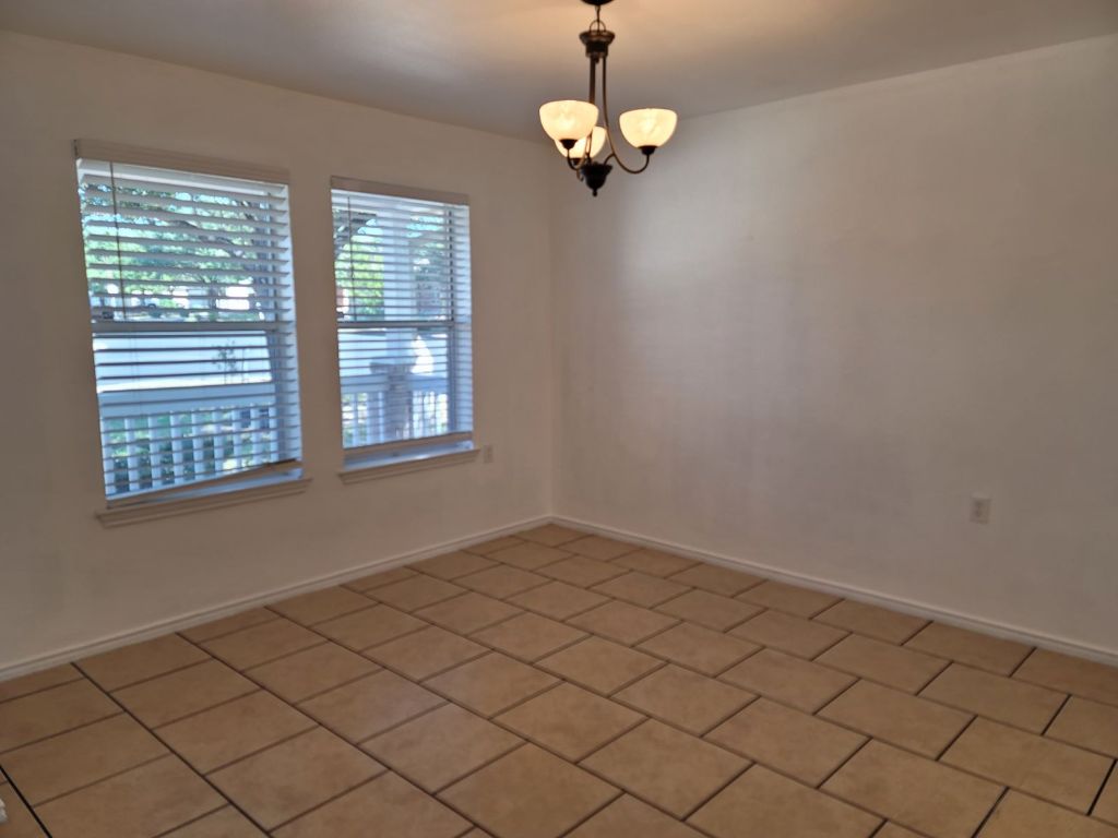 707 Windledge Drive Austin, TX 78745 - Photo 15 of 25 an empty room with windows