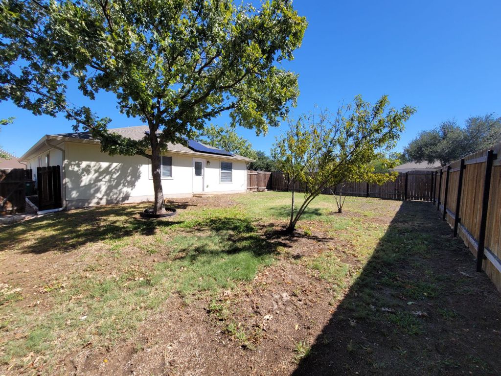707 Windledge Drive Austin, TX 78745 - Photo 25 of 25 a view of a yard with wooden fence