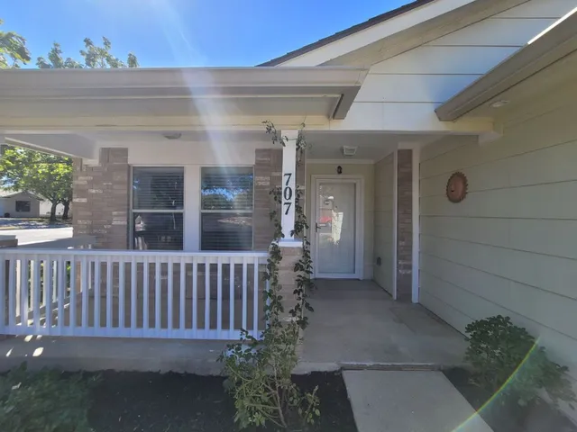 a view of a porch with a bench