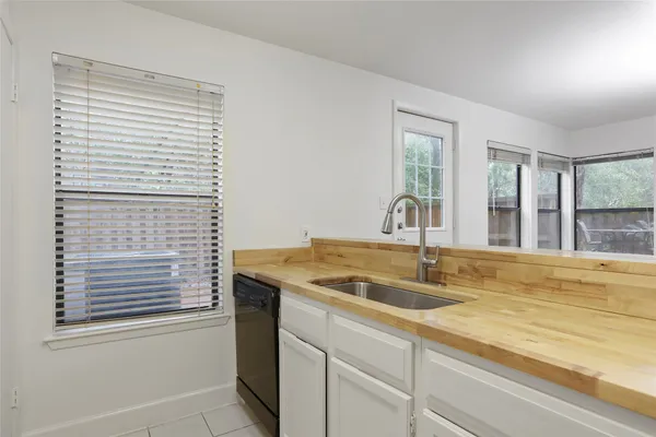 a kitchen with a sink and a window