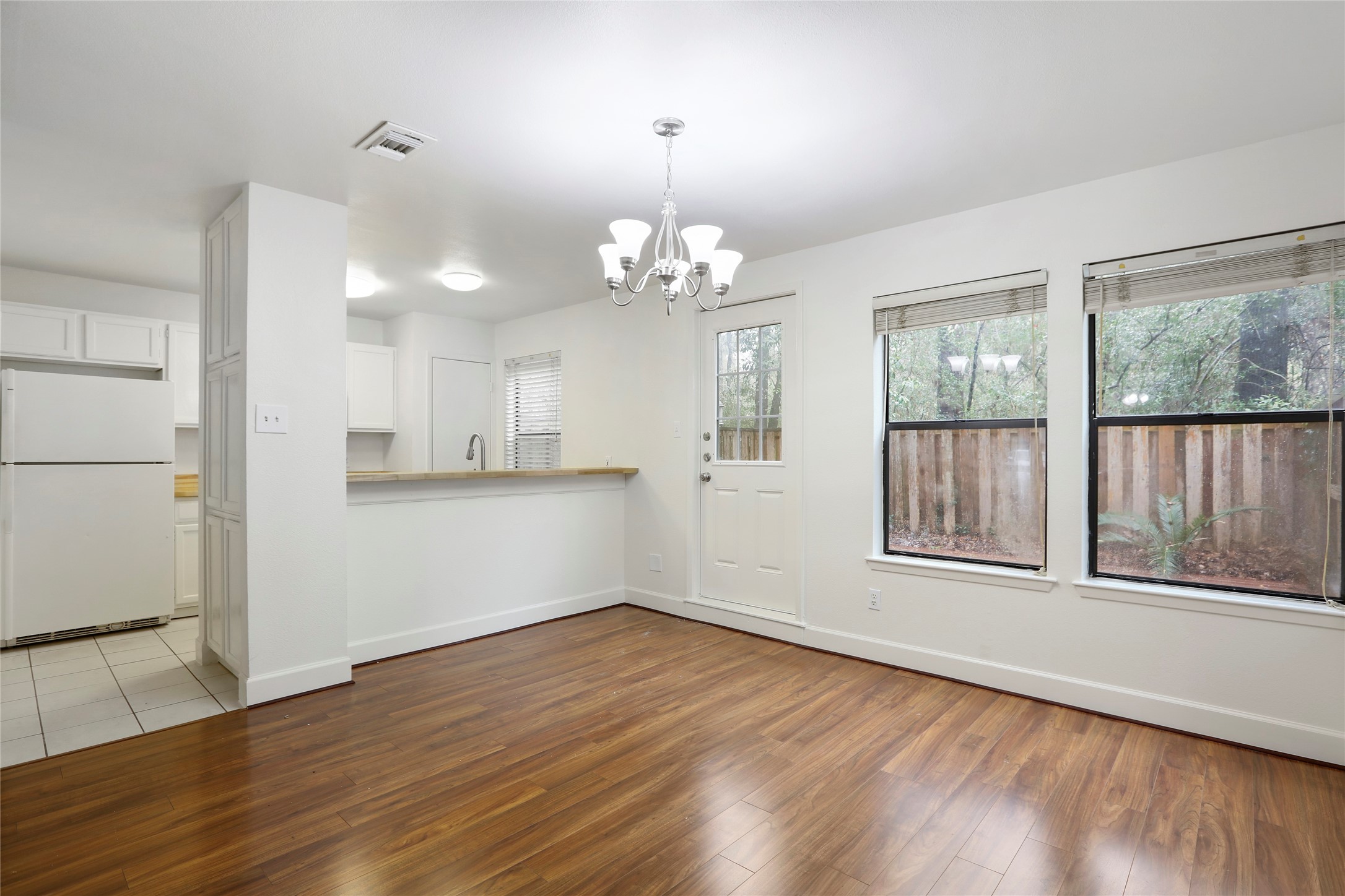 28 Sawmill Grove Lane Spring, TX 77380 - Photo 16 of 30 an empty room with wooden floor and windows