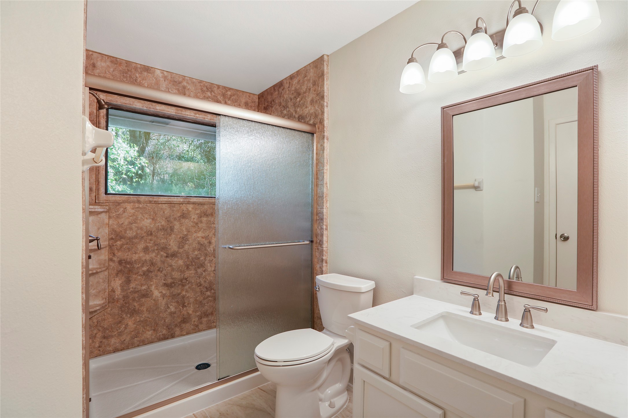28 Sawmill Grove Lane Spring, TX 77380 - Photo 22 of 30 a bathroom with a sink toilet and shower