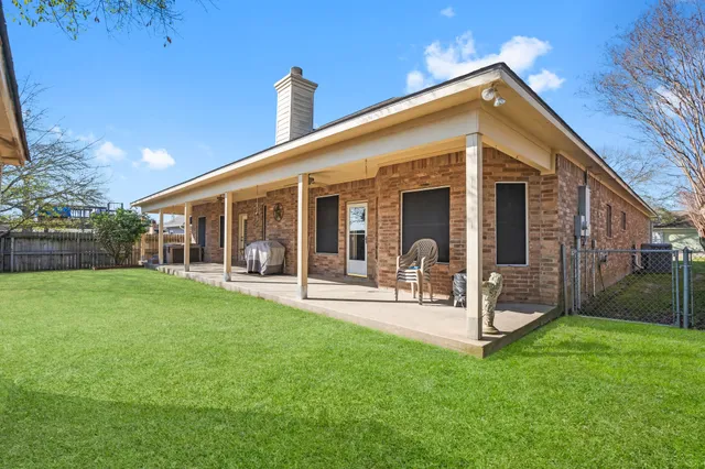 a front view of a house with garden and porch