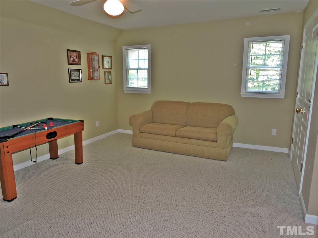 660 Charlie Reade Road Timberlake, NC 27583 - Photo 14 of 25 a living room with furniture and a window