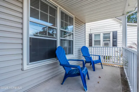 a view of a chair and table in the balcony