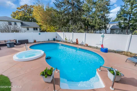 a view of a swimming pool with a patio