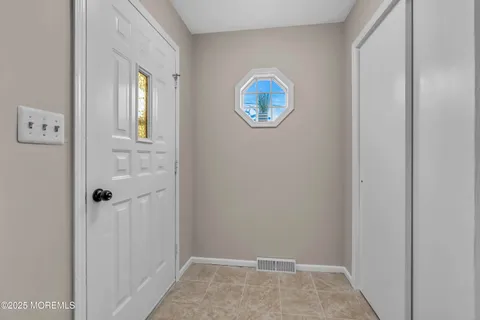 a view of a bathroom from the hallway