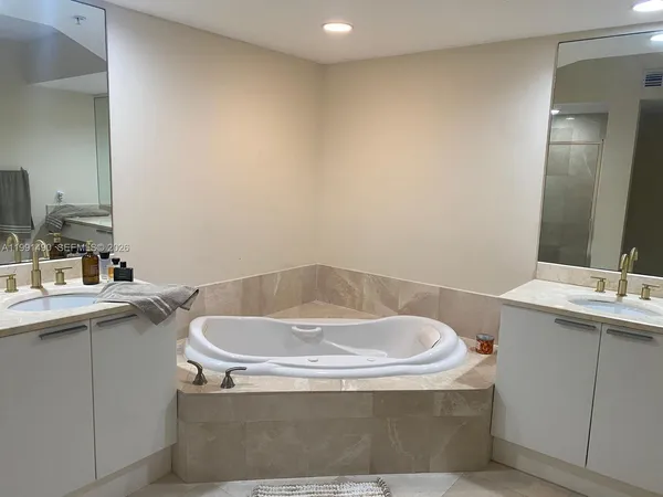 a bath tub sitting in a bathroom